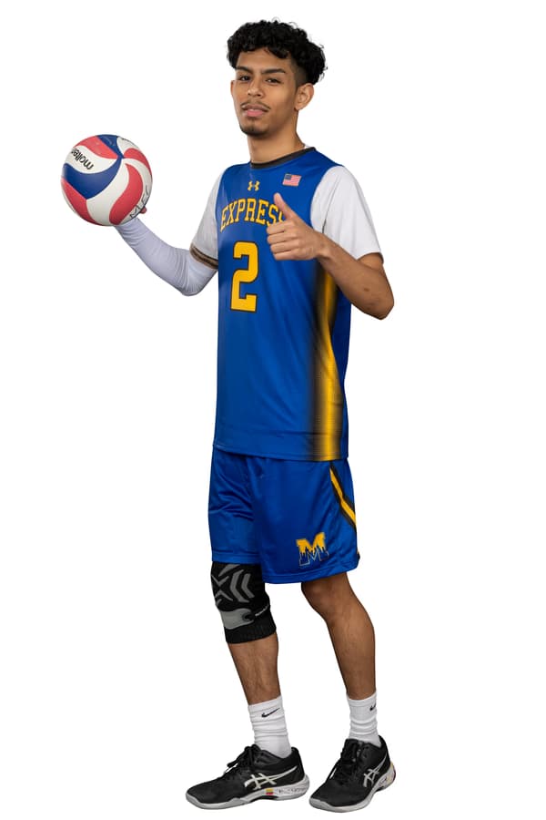 Studio full-body shot of a college volleyball player with a ball on white background; skin retouching, removing unwanted elements