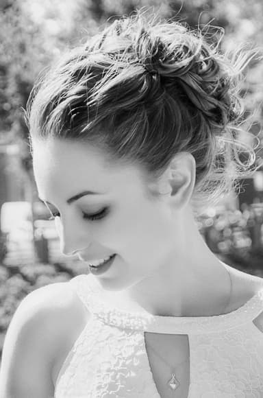 Black and white bridal close-up in profile, skin retouching with natural texture, stray hair removal, and soft contrast color correction