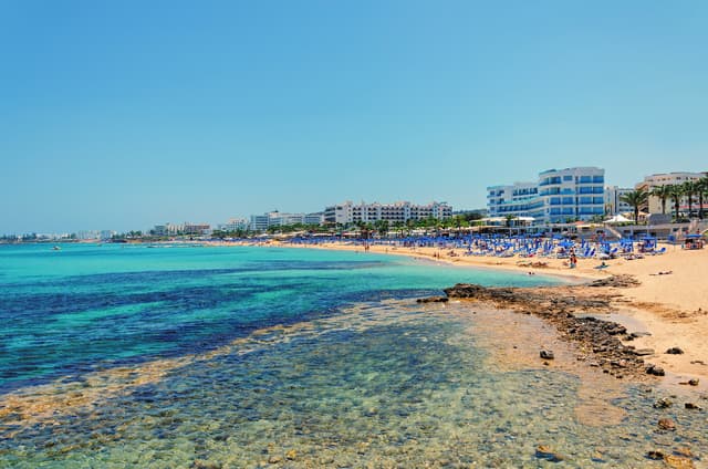 Sunny beach resort coastline, natural, accurate color balancing and exposure correction for clean, vibrant tones