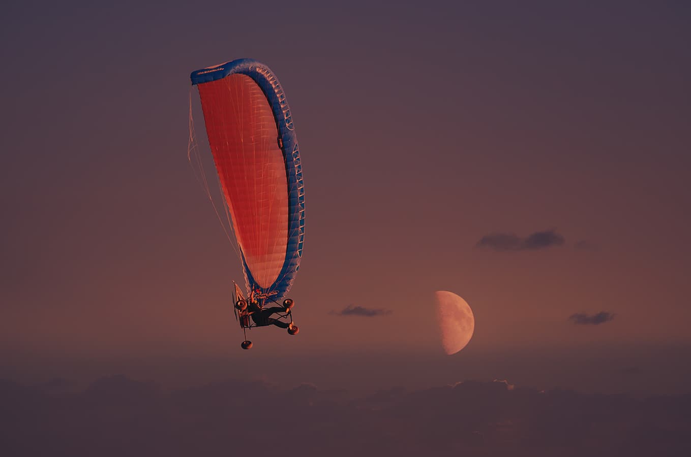 Paramotor paraglider flying at dusk with the moon; color correction, natural and accurate color balancing, and sky enhancement for soft twilight tones